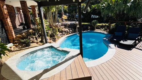 a small swimming pool on a wooden deck at The Hillside Retreat in Mount Tamborine