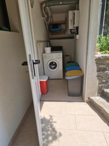 a small room with a washing machine in it at Hisa Taljat in Most na Soči
