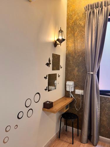 a room with a desk with a mirror and a window at Sim Vintage Villa Langkawi in Kuah
