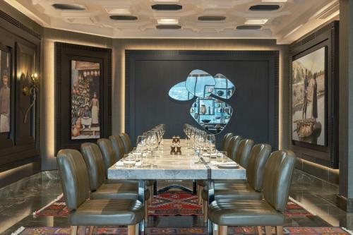 a conference room with a long table and chairs at Sheraton Grand Tbilisi Metechi Palace in Tbilisi City