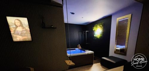 a black bathroom with a sink and a mirror at Luxury Loft Home Sweet House in Oupeye