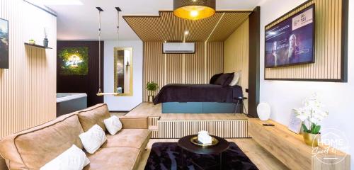 a living room with a couch and a bed at Luxury Loft Home Sweet House in Oupeye
