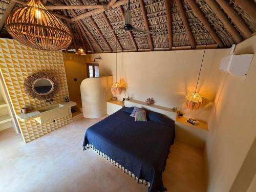 a bedroom with a blue bed in a room at Casa Moka in Puerto Escondido