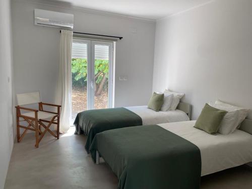 Ένα ή περισσότερα κρεβάτια σε δωμάτιο στο Quinta da Berlica