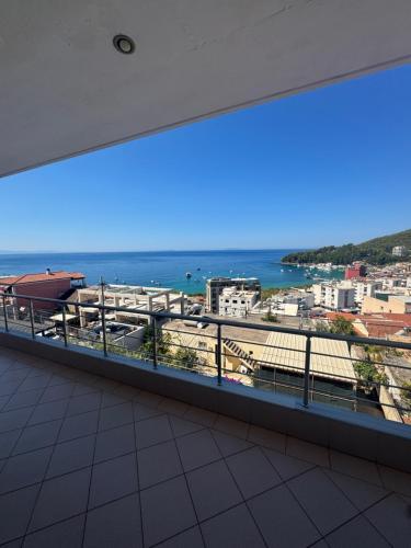 a balcony with a view of the ocean at Eleonora & Kyriakos Guesthouse in Himare