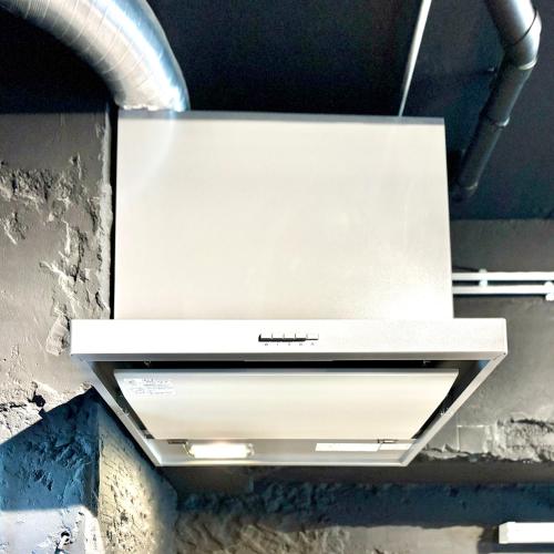 a white stove top oven hanging from a ceiling at Kumamoto Serviced Apartment Sakura Mee 桜美 in Kumamoto