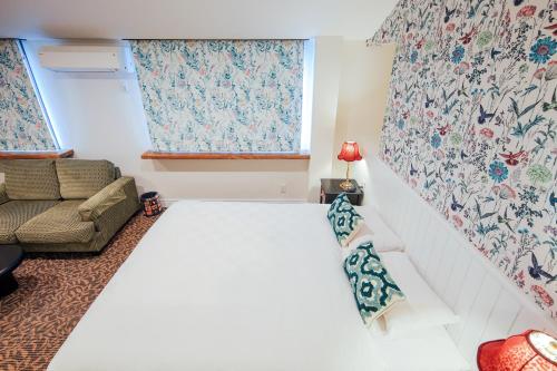 Postel nebo postele na pokoji v ubytování Hotel Wellies