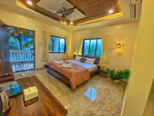 Un pat sau paturi într-o cameră la Beach Hive Resort Kashid