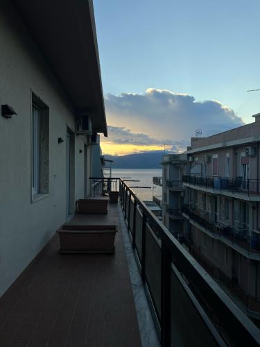 a balcony of a building with a view of the ocean at Stilla Chjara in Reggio Calabria