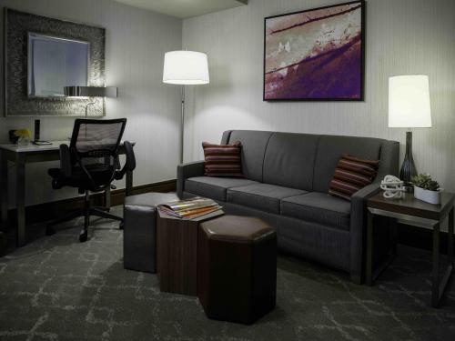 a living room with a couch and a chair at Saint John's Resort in Plymouth