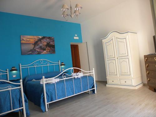 Postel nebo postele na pokoji v ubytování Holiday House ROSANNA