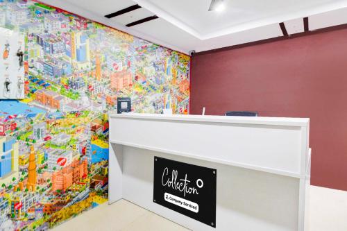 a wall with a large colorful mural on the wall at Townhouse Oak Begumpet Railway Station in Hyderabad