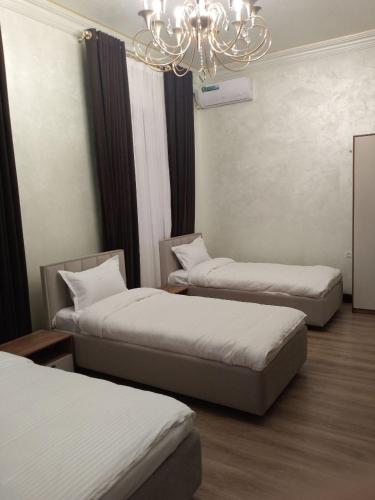 Katil atau katil-katil dalam bilik di Mehmon Hotel OK