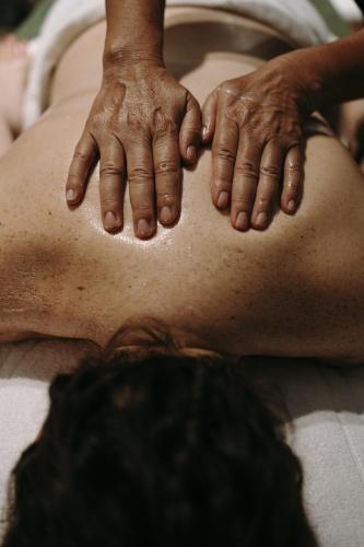 a man with his hands on his back at Villa Boscarino Boutique Hotel & Spa in Ragusa
