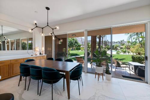 an open kitchen and dining room with a table and chairs at Tranquil & Spacious, Newly Updated,great Location in Indian Wells