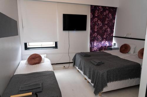 Cama o camas de una habitación en Grand Salo Hotel