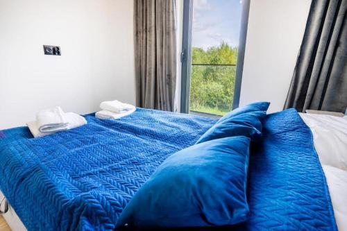Postel nebo postele na pokoji v ubytování Apartament Olimpijska