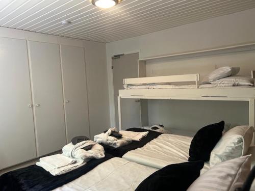 a bedroom with a bunk bed with towels on it at STF Korrö Gårdshotell - B&B in Linneryd