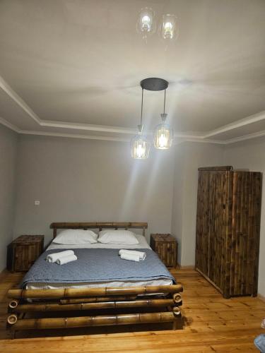 a bedroom with a bed with two towels on it at Broliskedi inn 