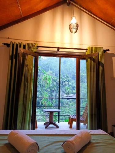 Ένα ή περισσότερα κρεβάτια σε δωμάτιο στο Sunshine Forest Lodge - Sinharaja
