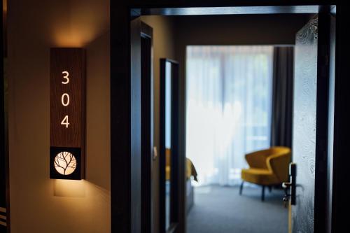 a room with a door with the number three on the wall at Salt Lake Hotel in Sovata