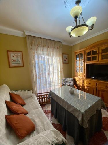 a living room with a couch and a table at La Torre in Tózar