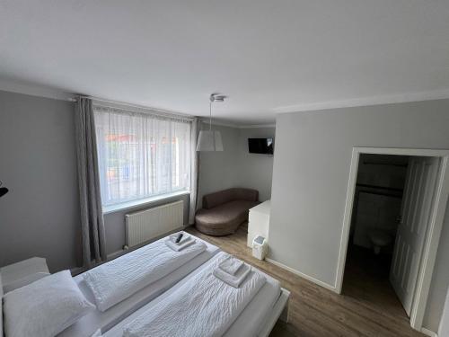 Letto o letti in una camera di Asiatisches Landhaus Pension