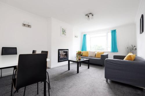 a living room with a couch and a table at Ideal Bath House by St James’s Park in Bath