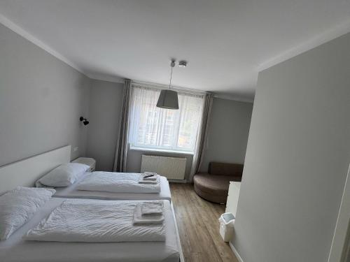 Letto o letti in una camera di Asiatisches Landhaus Pension