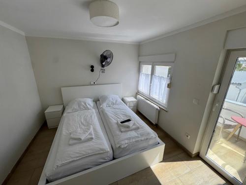 Letto o letti in una camera di Asiatisches Landhaus Pension