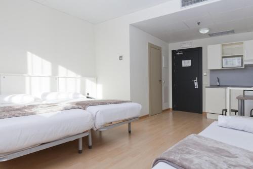 Voodi või voodid majutusasutuse Vértice Roomspace toas