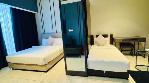 Un ou plusieurs lits dans un hébergement de l'établissement Axon Residence KL Bukit Bintang