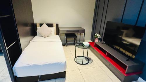 Un ou plusieurs lits dans un hébergement de l'établissement Axon Residence KL Bukit Bintang