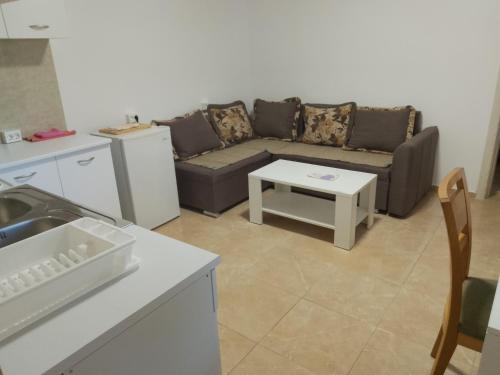 a living room with a couch and a table at Guest house Danica in Bar