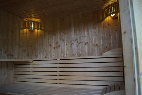 a wooden sauna with two beds in it at Drau Lodge in Wernberg