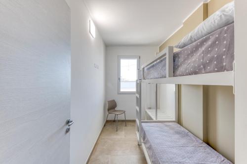 Postel nebo postele na pokoji v ubytování Residence Fronte Mare
