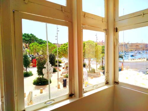 an open window with a view of a street at Seafront 1 bedroom Maisonette in Kalkara