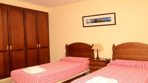 Postel nebo postele na pokoji v ubytování Apt. Heliconia Nº 4