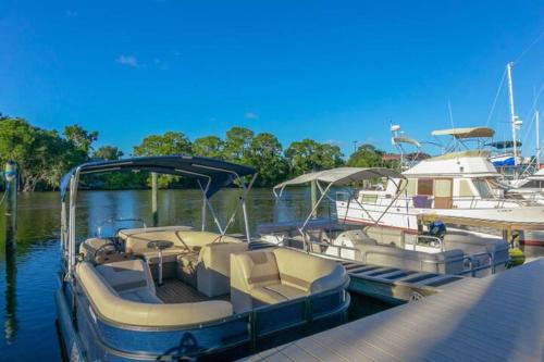 a boat is docked at a dock in the water at Cape Crossing 104 in Merritt Island