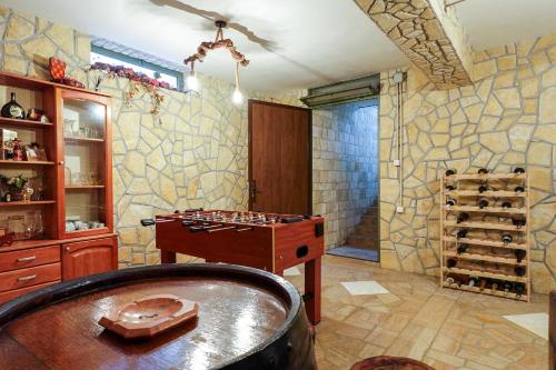 a bathroom with a chess board and a table in a room at Rural Holiday House Monto in Gladovec Pokupski