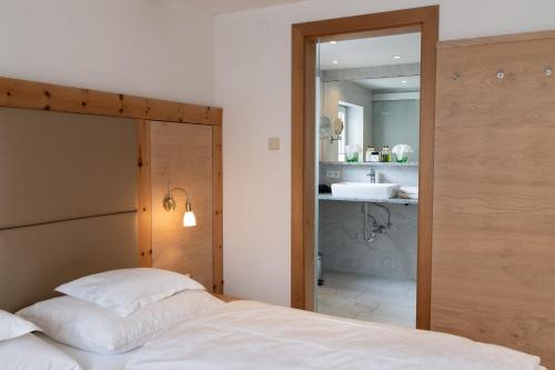 Katil atau katil-katil dalam bilik di Wellnesshotel Mein Almhof Superior