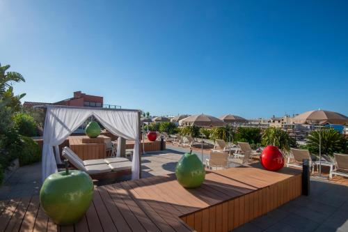 a patio with a gazebo and chairs and a table at Best Western Premier Le Patio des Artistes Wellness Jacuzzi in Cannes