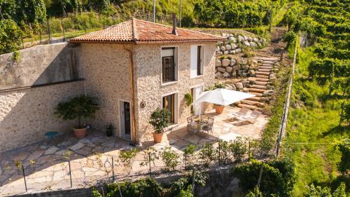 an aerial view of a house with an umbrella at IL Pollaio in Farra di Soligo