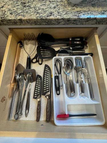 a drawer filled with utensils in a kitchen at Elegant 3BR Home in Worcester in Worcester
