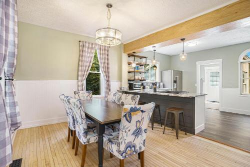 a kitchen and dining room with a table and chairs at Third Haven in South Haven