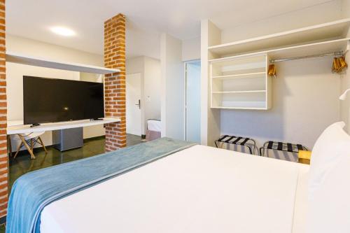 Postel nebo postele na pokoji v ubytování Filimahalo Hotel