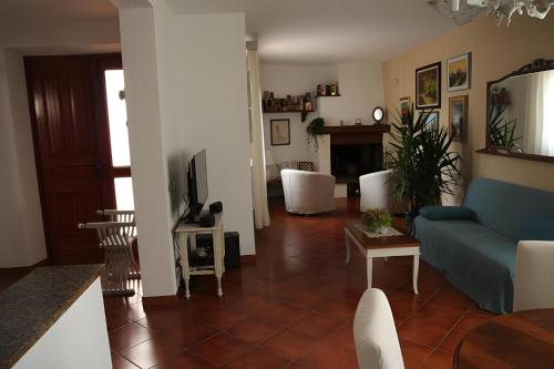 a living room with a couch and a table at Casa Marcobando - Lucca in Lucca