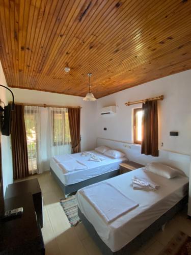 Postel nebo postele na pokoji v ubytování Plaj Hotel