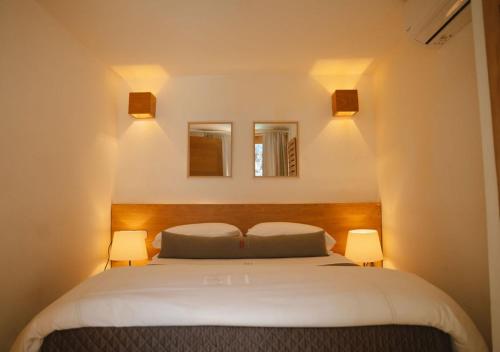Postel nebo postele na pokoji v ubytování Billini Hotel, Historic Luxury