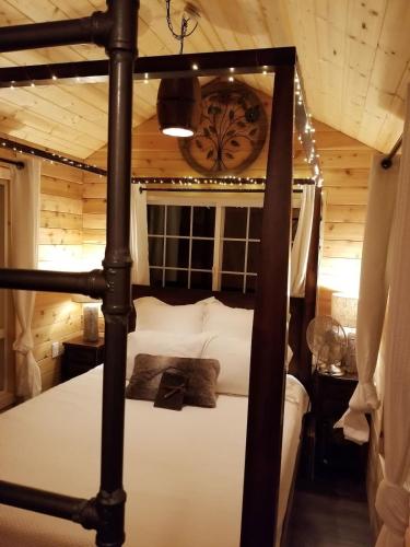 a bedroom with a bed with a wooden ceiling at Treehouse Place at Deer Ridge Featured top 10 USA in Snohomish